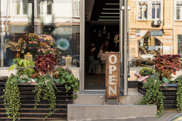 Photo of a commercial property building with open sign out front